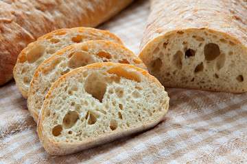 Fresh sliced italian Ciabatta bread on background