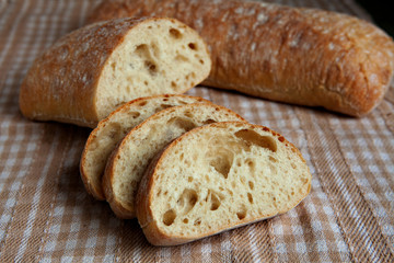 Fresh sliced italian Ciabatta bread on background