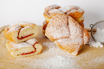 baked pastry with jam filling on table background, homemade bakery