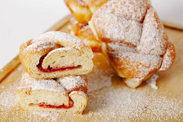 baked pastry with jam filling on table background, homemade bakery