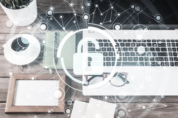 Obraz premium Business workplace with laptop coffee cup and security concept o