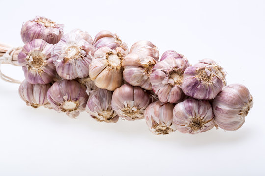 String of garlic isolated on white background
