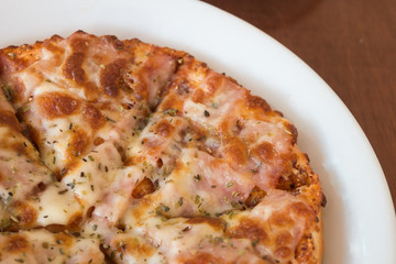 close-up,Delicious Pizza with Ham, Bacon and sausages