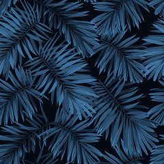 Naklejka premium Indigo vector seamless pattern with monstera palm leaves on dark background. Summer tropical camouflage fabric design.