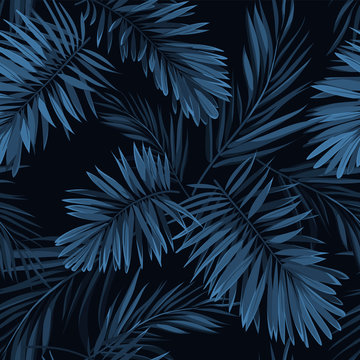 Seamless vector indigo blue pattern with monstera palm leaves on dark background. Summer tropical fabric design.
