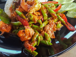 Thai food style delicious:Stir spicy fried shrimp curry lentil and vegetables herbs