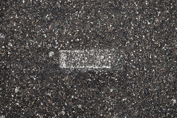 Fototapeta premium White grungy stripe on asphalt road
