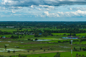 Fototapeta na wymiar Thailand landscape of rural city and mountain under the cloudy sky