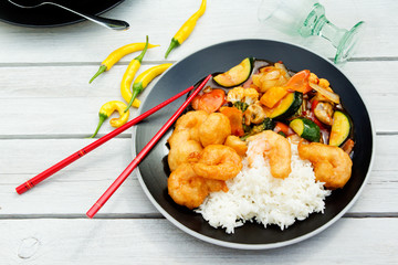 Hot Thai fried vegetables and rice with breaded chicken