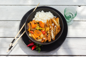 Hot Thai fried vegetables and rice with breaded prawns