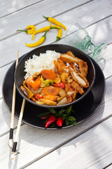 Hot Thai fried vegetables and rice with breaded prawns