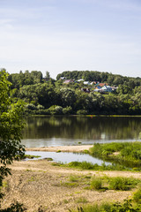 beautiful landscape with a river and a sandy beach on a summer day.