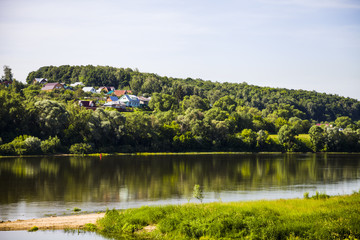 beautiful landscape with a river and a sandy beach on a summer day.