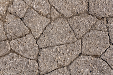 Cracked asphalt road surface texture. Grey texture of the road