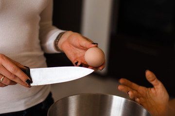 hand break table knife shells quail egg closeup.