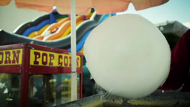Close-Up of a Man Cooking a Candyfloss at Amusement Park