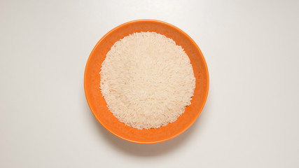 TOP VIEW: White rice on a orange dish