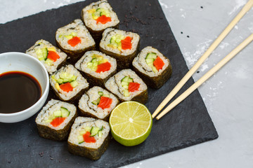 Healthy homemade sushi rolls with brown rice and fish.