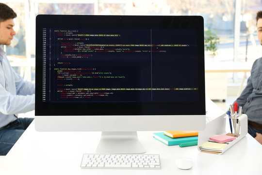 Web site codes on computer monitor in office