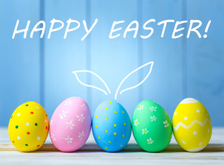 Easter eggs on wooden background