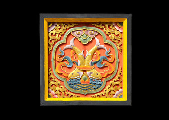 Colorful of wood carving traditional Bhutan style on black background