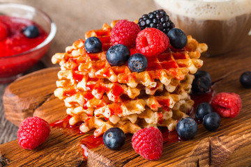 Belgian waffles with fresh berries and coffee 