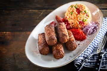 Traditional cevapcici with savory rice