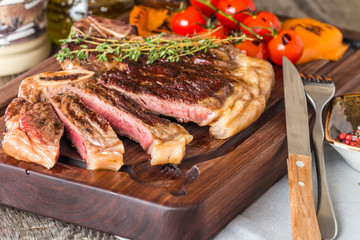 Beef steaks with grilled vegetables and seasoning 