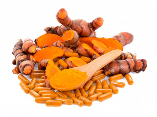 Turmeric root Turmeric capsule and Turmeric powder in wooden spoon on white background