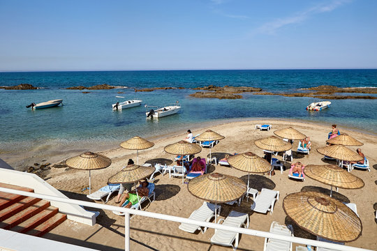 beautiful landscape of blue sky and sea or ocean water beach with stone and boats sunny outdoor on natural background