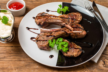 Grilled lamb ribs with sauce
