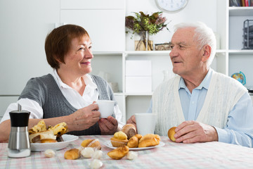 Elderly couple having breakfast