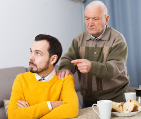 Aged father teaches his son
