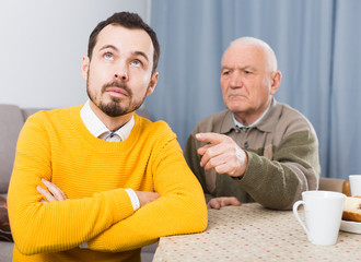 Fototapeta premium Aged father teaches his son