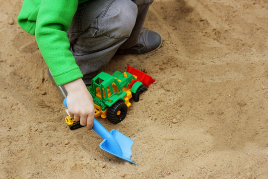 Kids play in the sandbox.