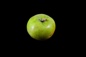 Green apple isolated on black