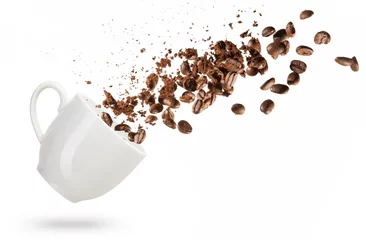Wall murals Cafe coffee beans spilled out of a cup isolated on white background