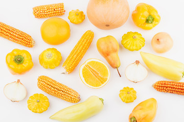 Background from yellow and orange fresh raw vegetables and fruits, light background