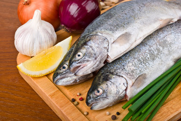 Fresh raw fish trout with vegetables