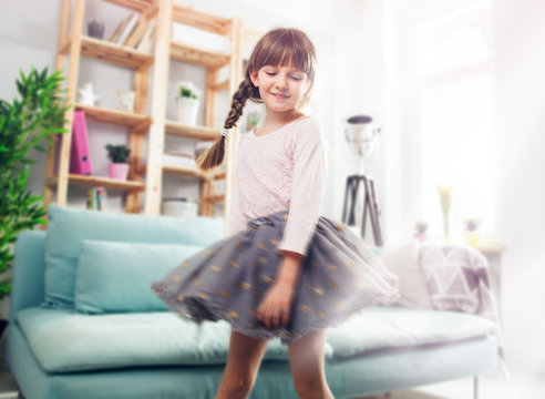 Cute Little Child Girl Dancing At Home