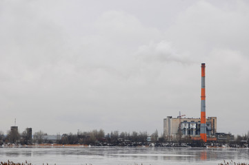 Obraz premium Waste incinerator plant with smoking smokestack. The problem of environmental pollution by factories