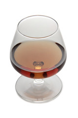 Glass with brandy and whiskey on white background
