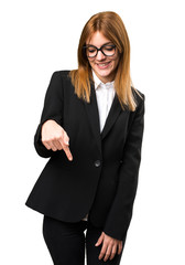 Young business woman pointing down