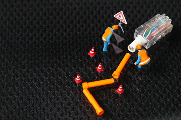 The damaged lan connection cable plug and maintenance figure miniature model represent the computor business and technology concept related idea. 
