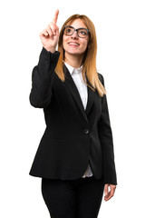 Young business woman touching on transparent screen