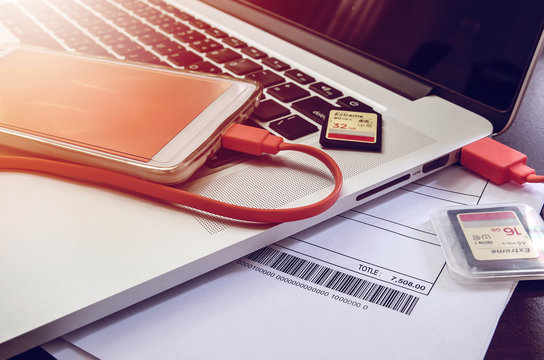 smartphone and SD card on laptop