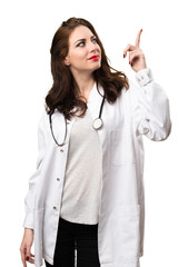 Doctor woman pointing up