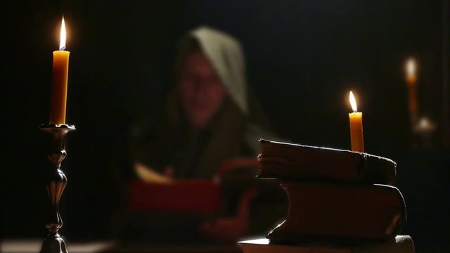 Monk Studying Old Religious Books