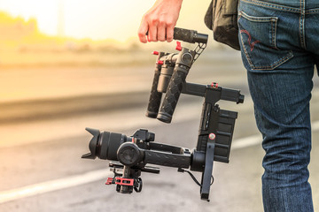 Videographer with gimbal video camera dslr, Professional video equipment, Videographer in event...