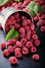 A bucket with scattered berries